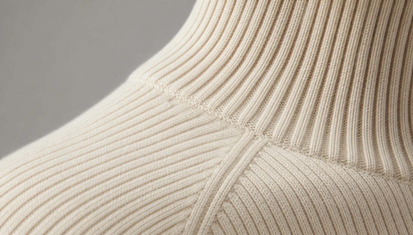 Concept render placeholder showing an ivory rib-knit shoulder detail